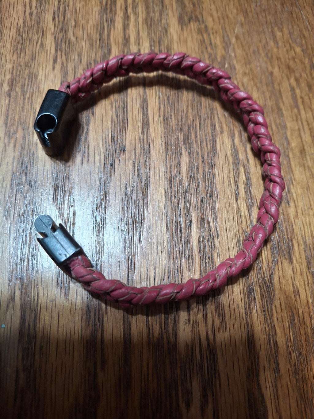 Red Bolo Bracelet with black metal clasp. 2 1/2" ID