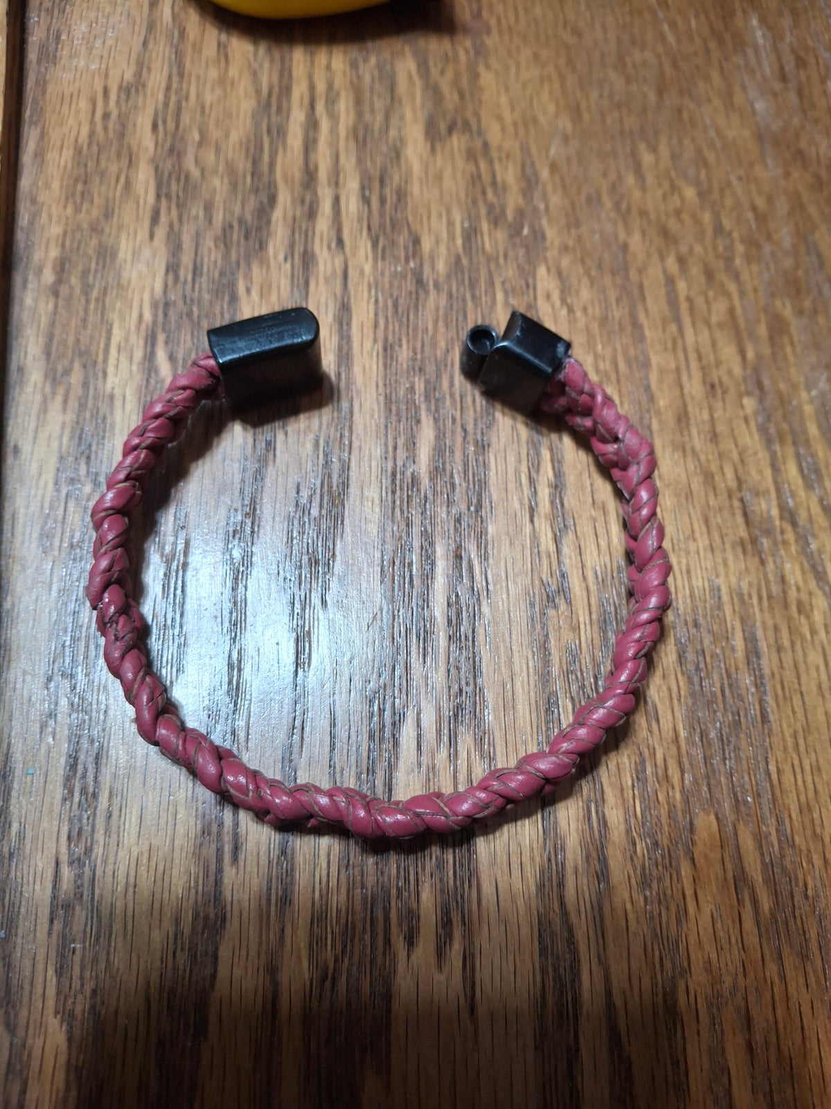 Red Bolo Bracelet with black metal clasp. 2 1/2" ID