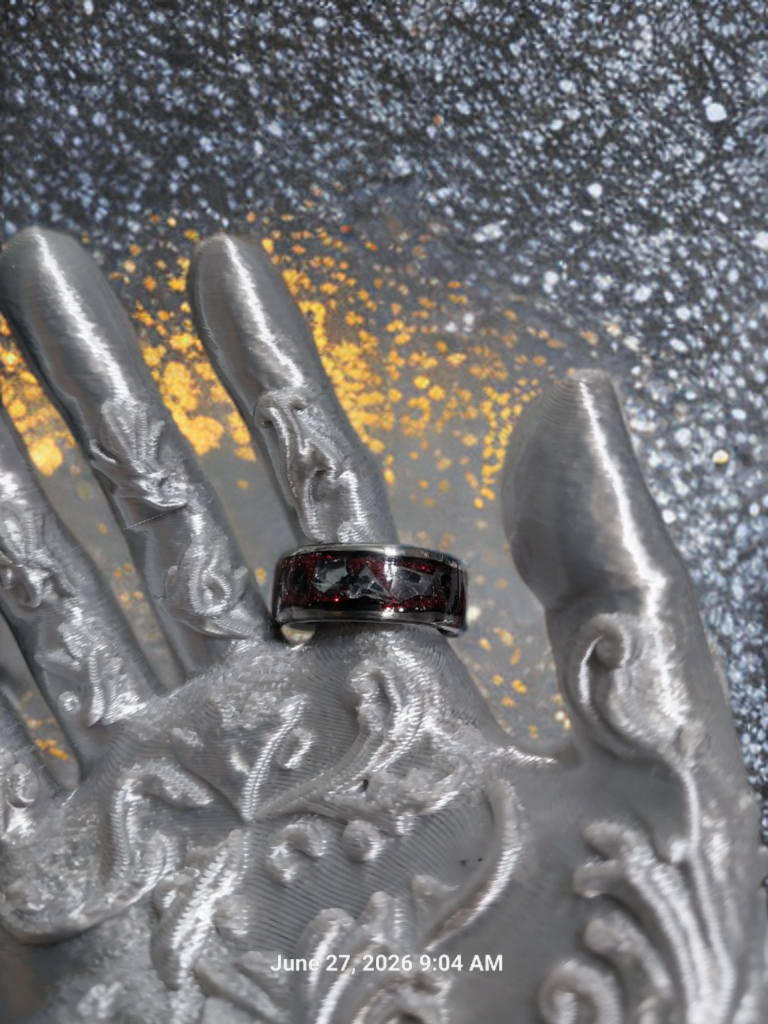Handmade Ring. Clear stones with Red Glitter. Band is Stainless Steel. Size 7