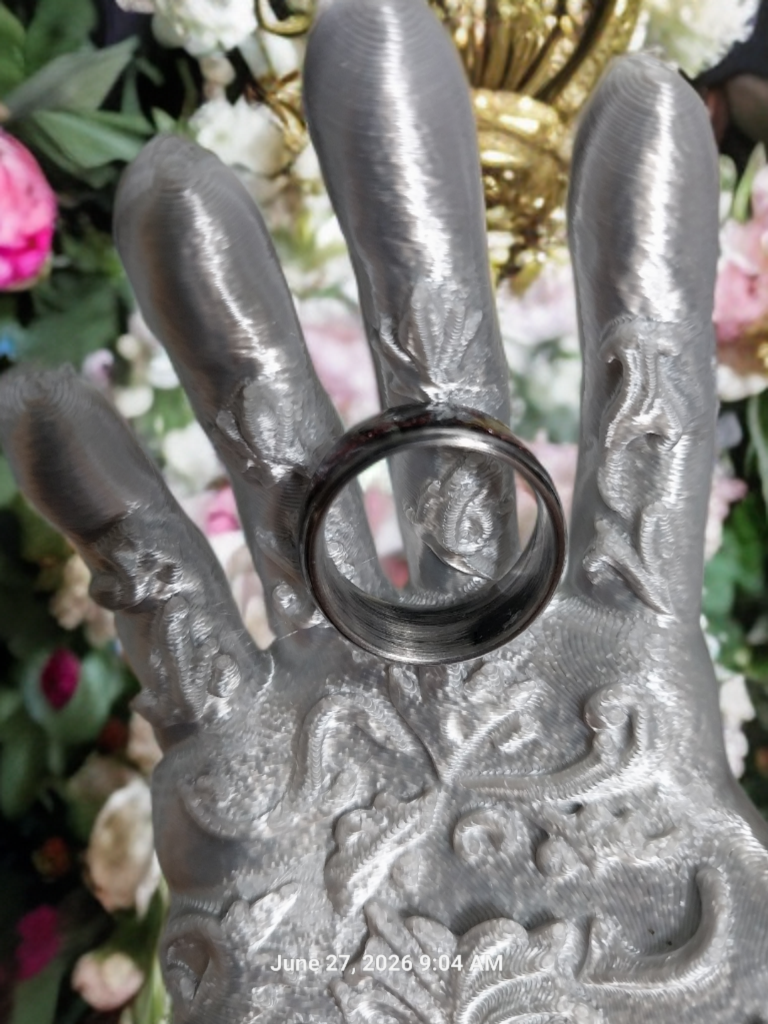 Handmade Ring. Clear stones with Red Glitter. Band is Stainless Steel. Size 7