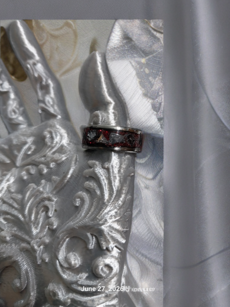 Handmade Ring. Clear stones with Red Glitter. Band is Stainless Steel. Size 7